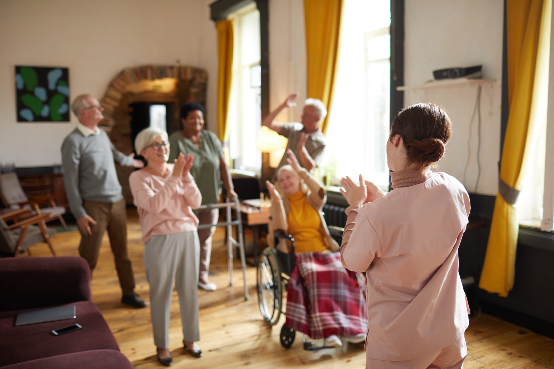 diverse-group-smiling-senior-people-dancing-while-enjoying-activities-retirement-home-with-you
